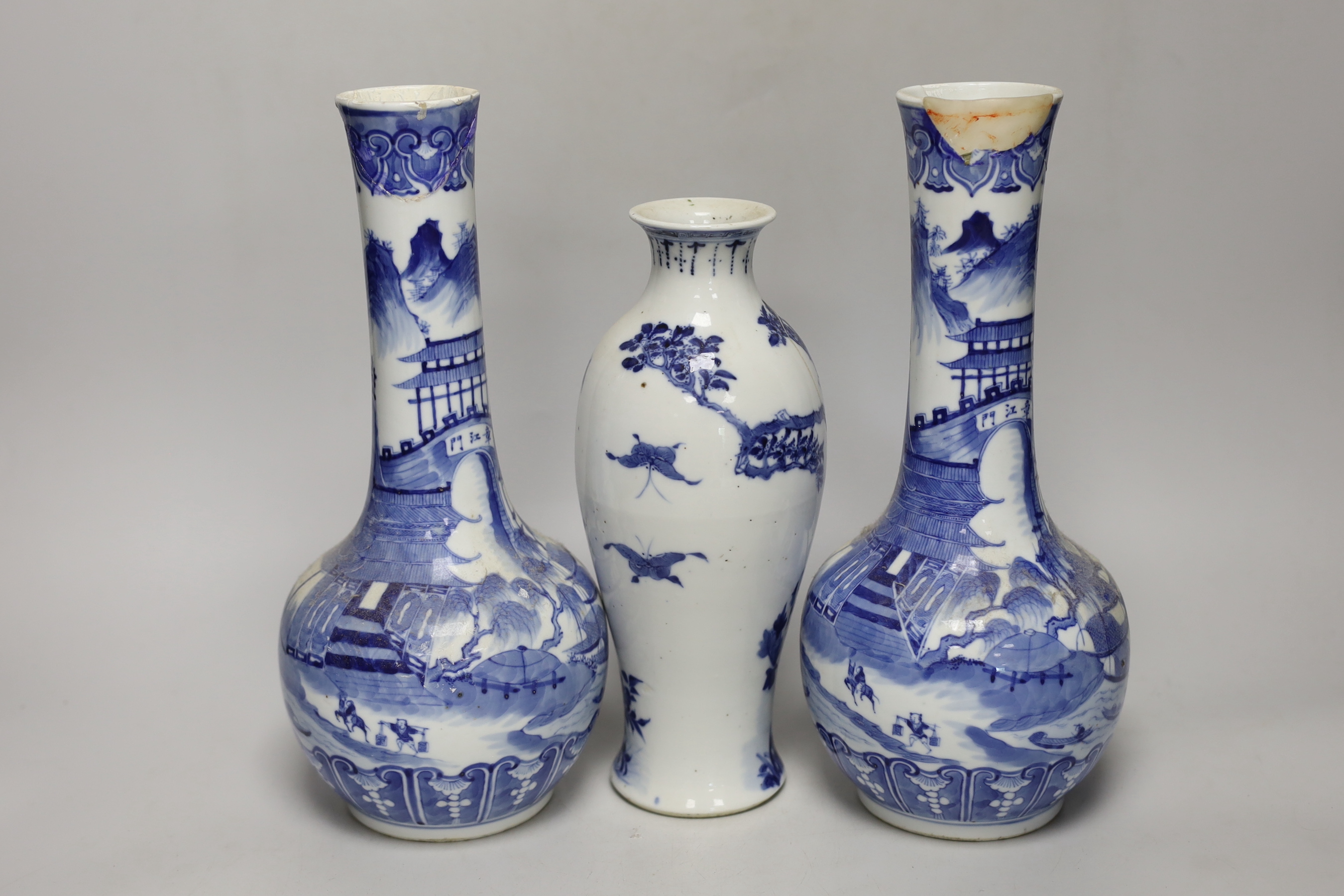 A pair of Chinese blue and white bottle vases and another vase, pair of vases 30cm high (a.f.)